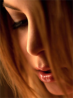 Amber Sym strips nude to expose her endless beauty