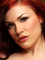 Andy San Dimas fingers her snatch on the red couch