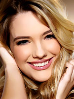 Kenna James spreads wide in front of the fireplace